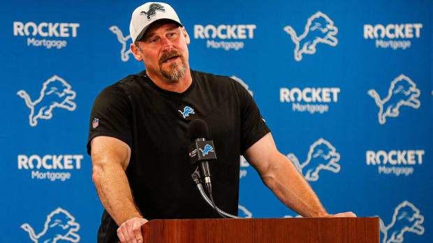 Dan Campbell speaks at a Lions podium